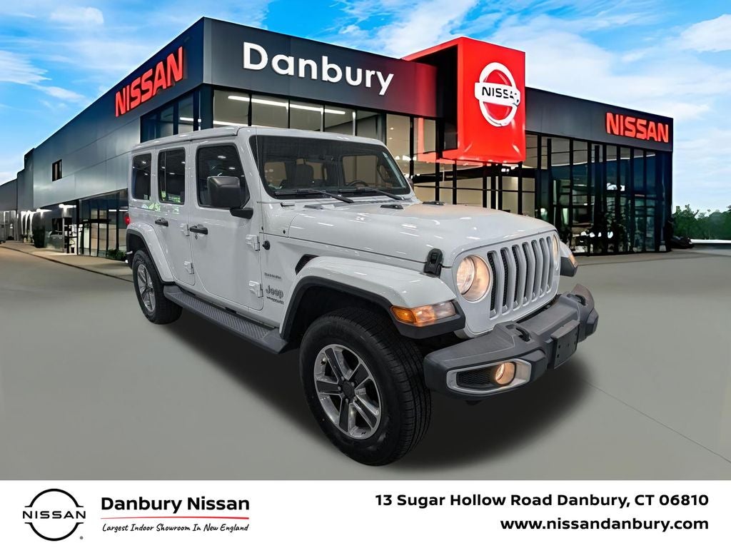 2018 Jeep Wrangler Unlimited Sahara in Bright White Clearcoat — front three-quarter view