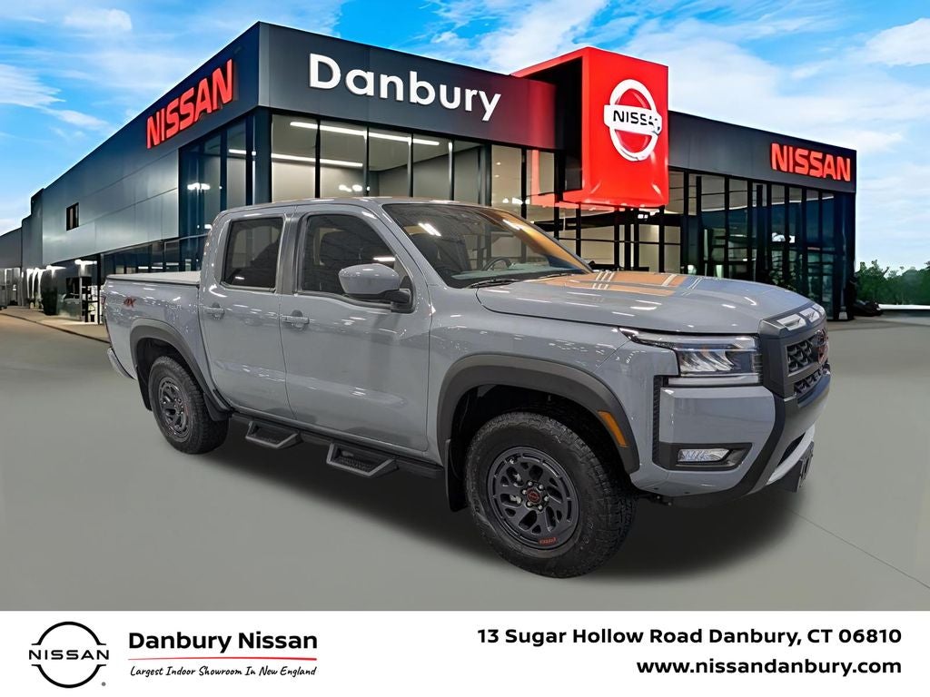 2025 Nissan Frontier PRO-4X in Boulder Gray Pearl — front three-quarter view