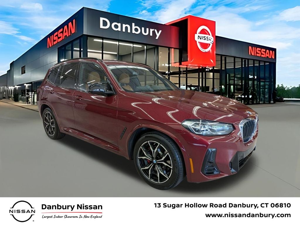 2024 BMW X3 M40i in Aventurin Red Metallic — front three-quarter view