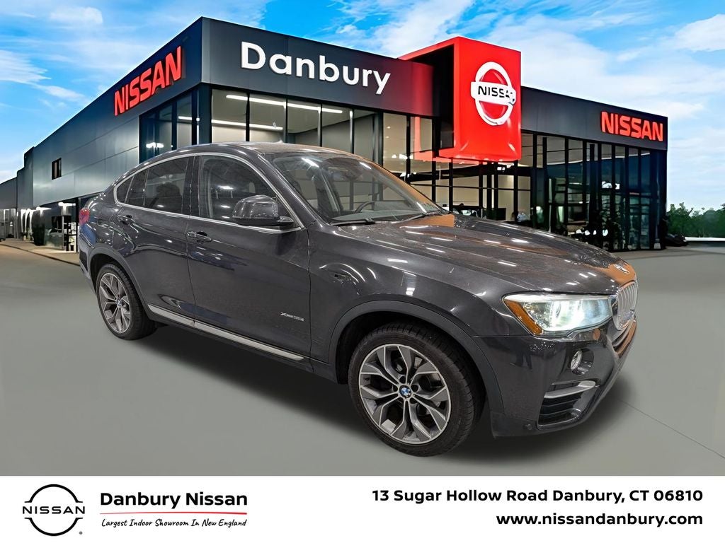 2015 BMW X4 xDrive35i in Dark Graphite — front three-quarter view